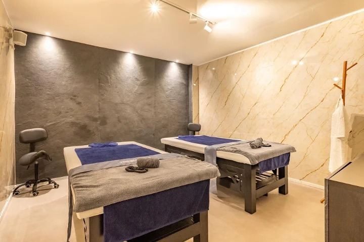 A couples treatment room with two massage tables